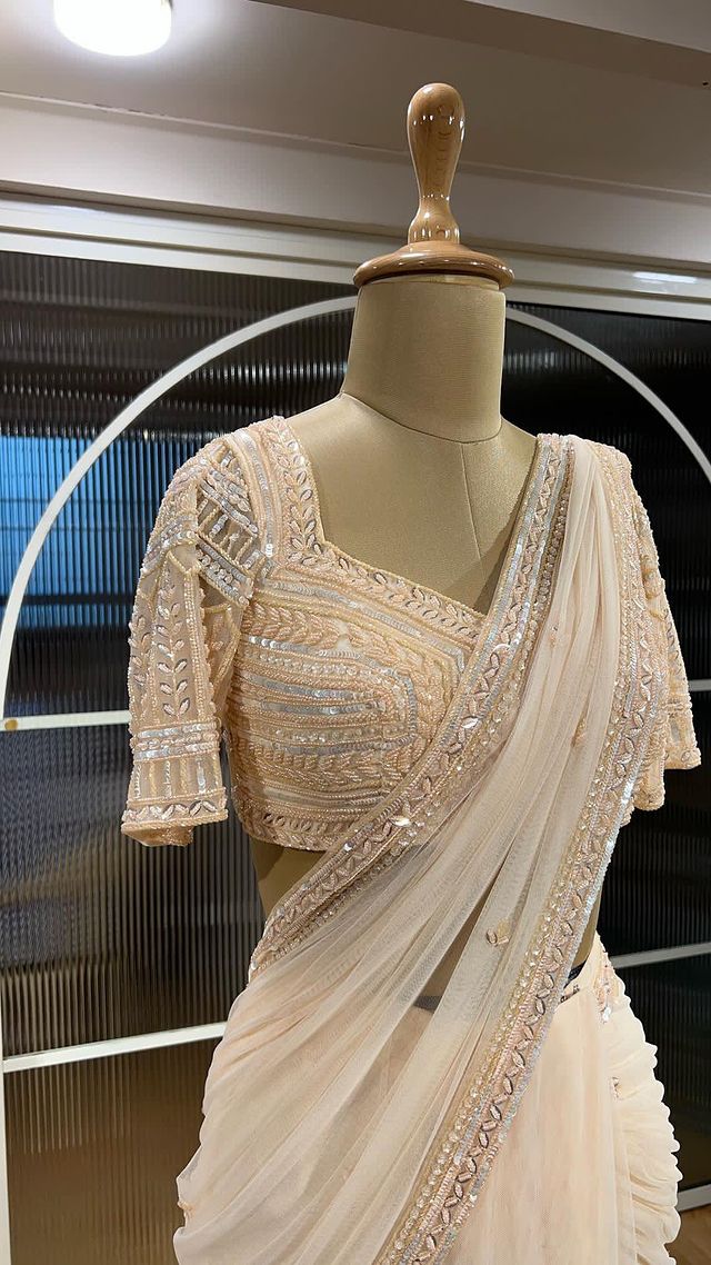Luxury at its best. This hand embroidered Predraped saree set is a sheer luxury and a piece of art. 