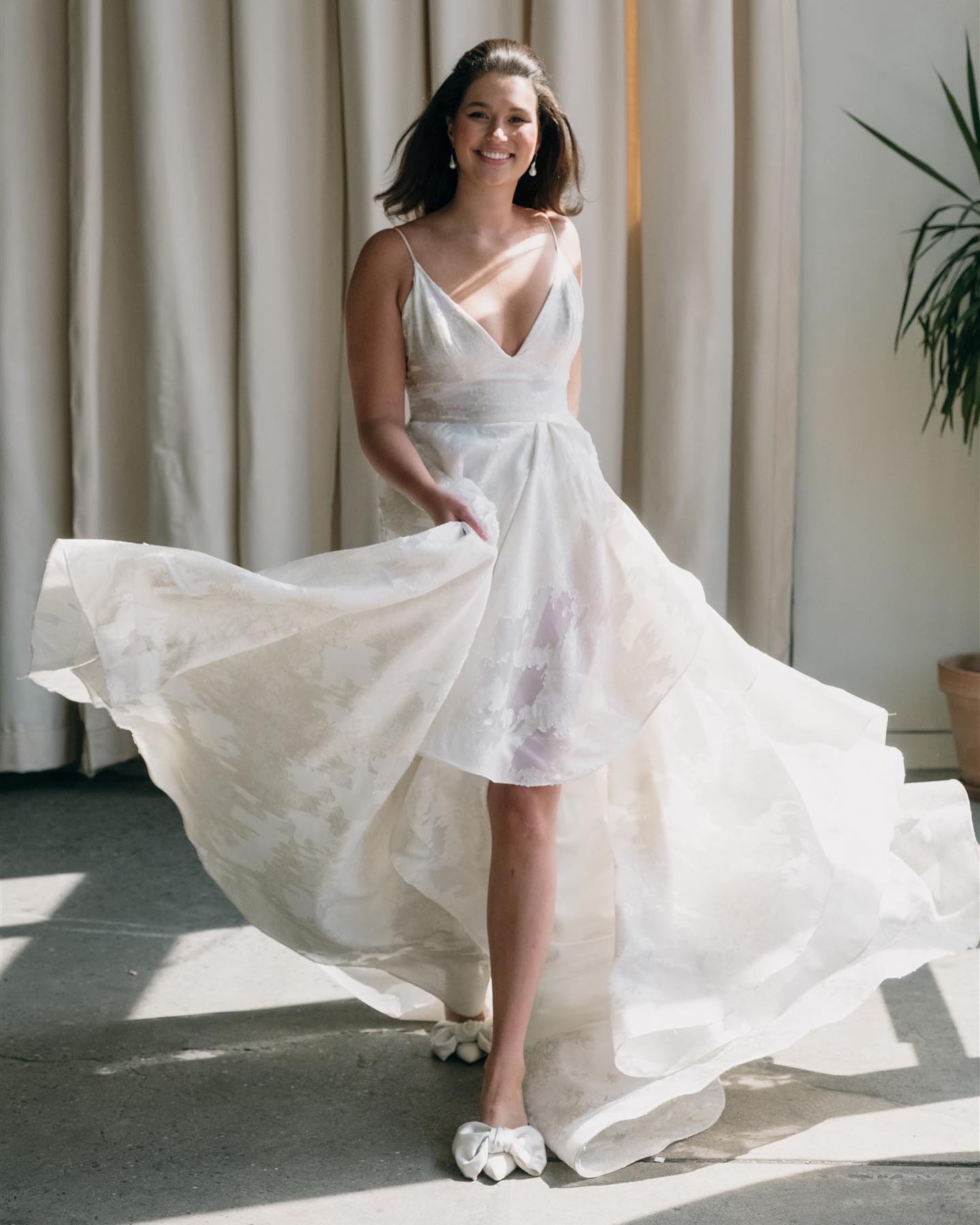 Bold metallics, sweet ruffles, a sexy slit, and an easy spaghetti strap tank bodice are harmoniously