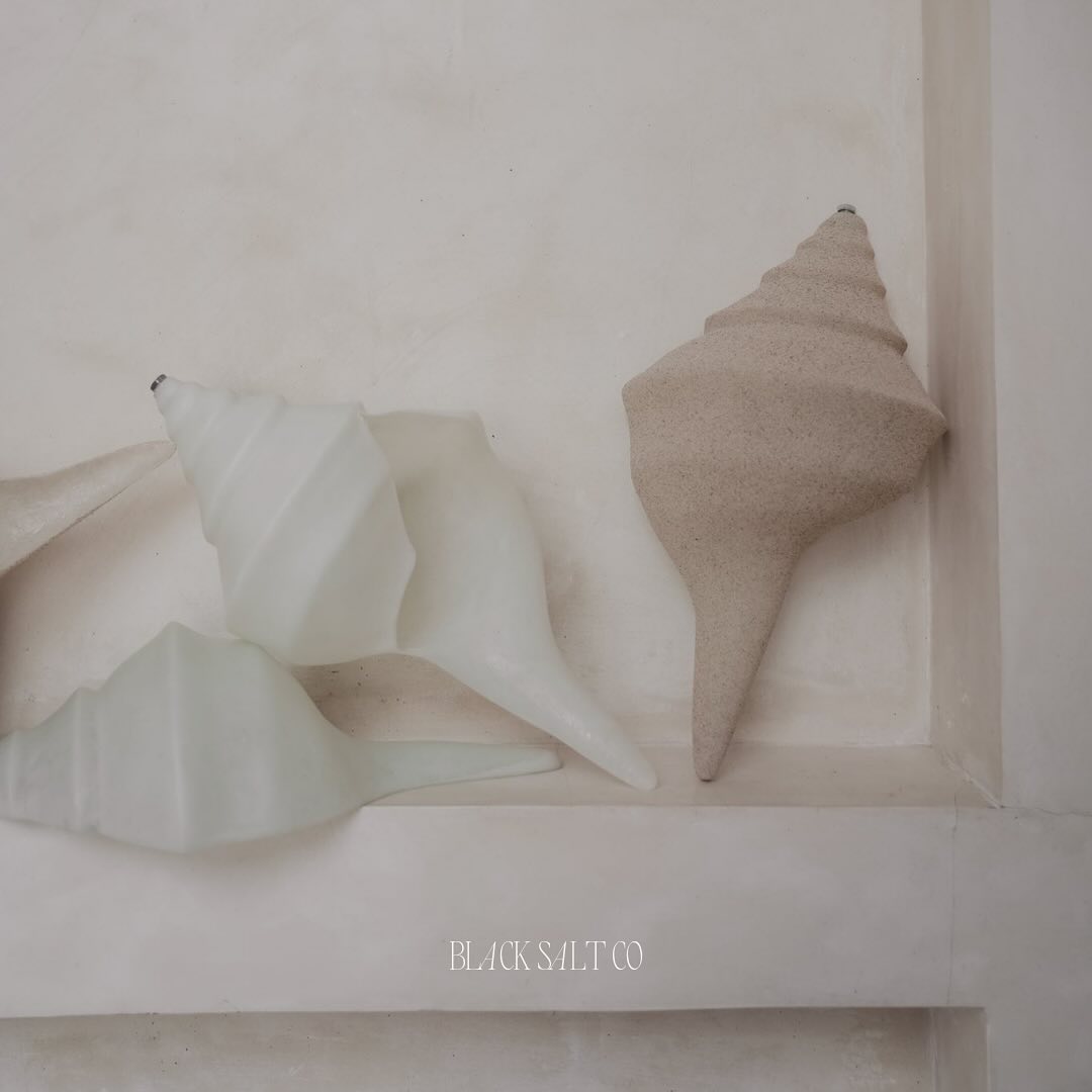 Staying true to our signature wavy and sculptural design aesthetic, the shell sconce and pendants in