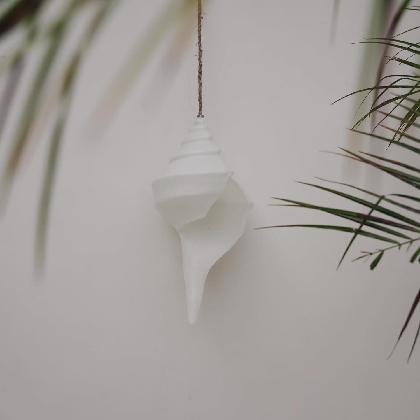 Staying true to our signature wavy and sculptural design aesthetic, the shell sconce and pendants in