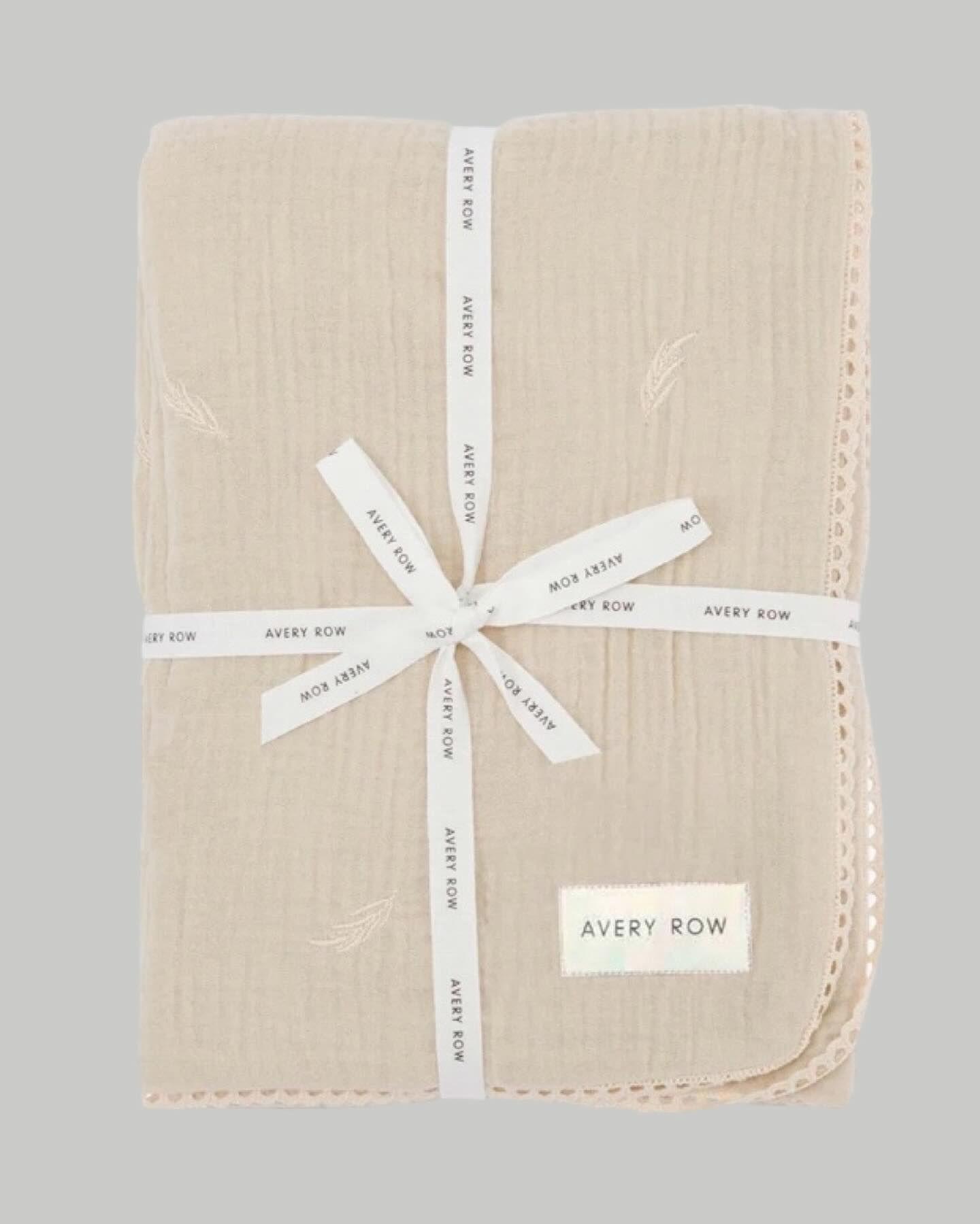 Beautiful embroidered (grasslands) light weight muslin blanket with lace trim. 

Shop it in our Text