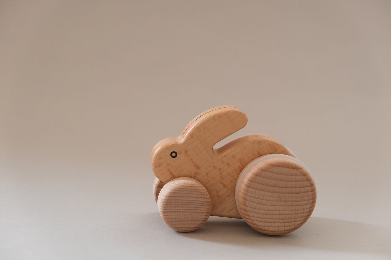 Hop little bunny hop! This little wooden toy is available for purchase on our site. When rolled alon