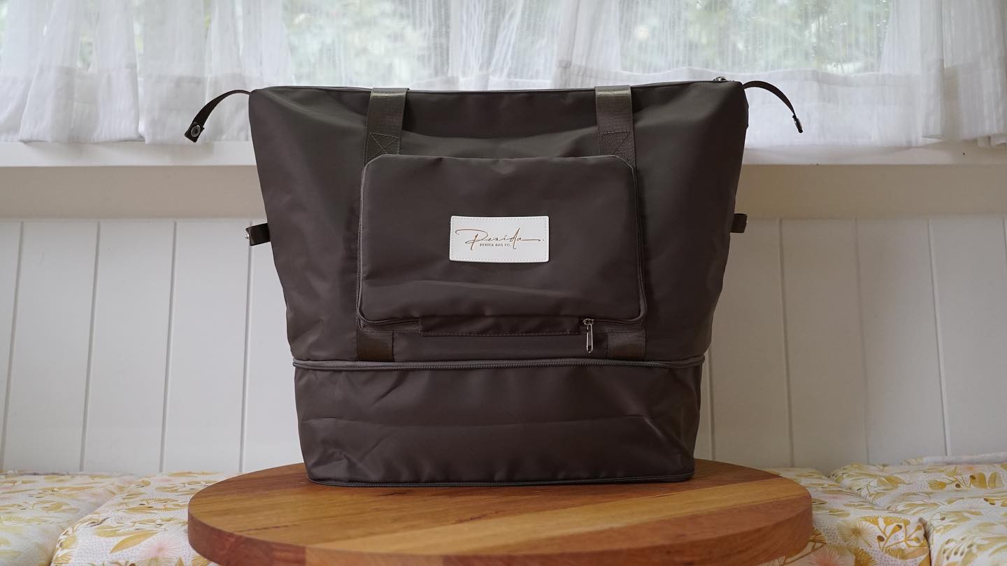 Always wish your bag was a little bit bigger on the way home from a trip? The PENIDA Overnighter is 